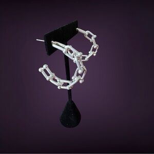 Non Branded Link Earrings . NWOT Boutique quality. Not too heavy. Silver color.